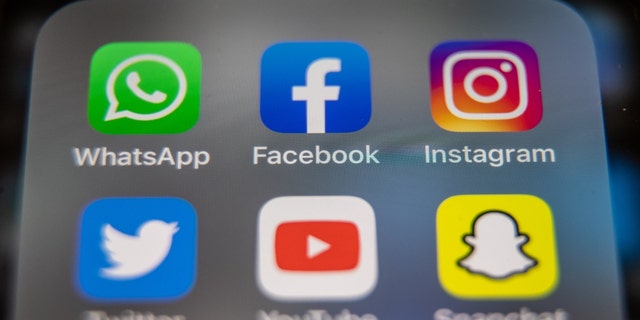 In this photo illustration, the logos of Facebook, WhatsApp and Instagram are displayed on a smartphone screen March 14, 2022, in Glastonbury, England.